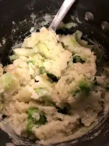 Potatoes and cabbage mixed in a pot