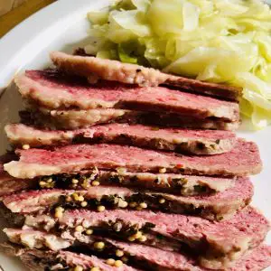Slices of corned beef and cabbage on a plate