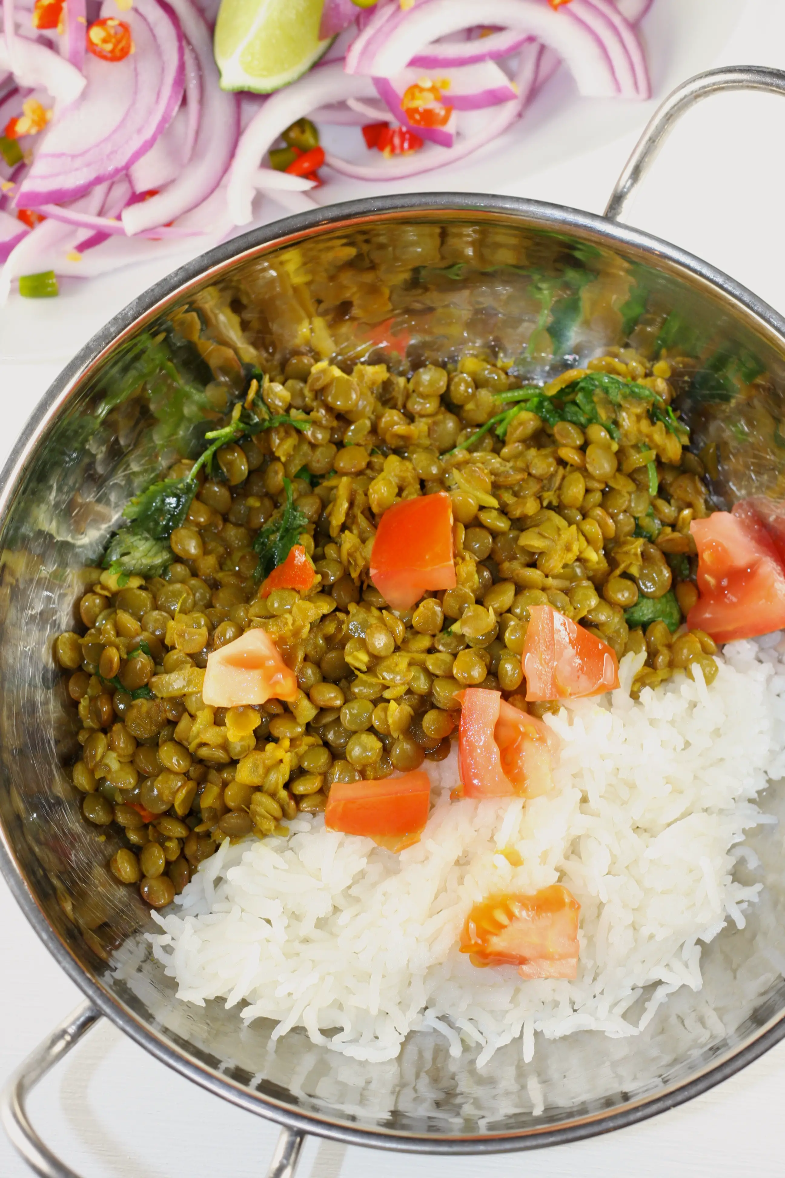 Indian Spiced Lentils With Onion Salad and rice in a bowl