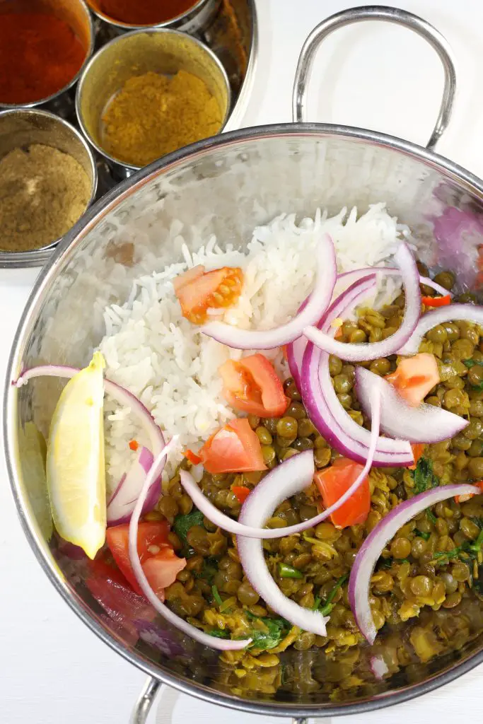 Indian Lentils Served in Karahi Bowl with onion salad and basmati rice