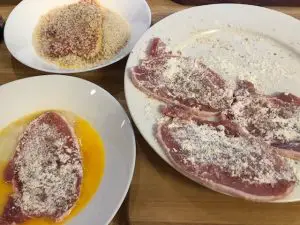 Pork cutlets dusted with flour
