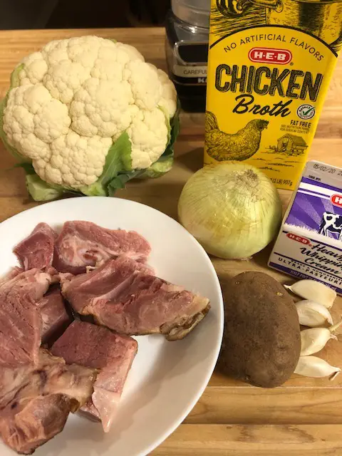 Cauliflower, ham, chicken broth, garlic, onion, heavy cream, and potato