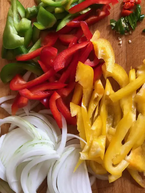 Onion, green red and yellow bell pepper, thai chilis