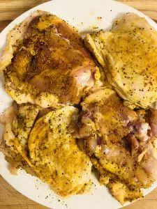 chicken seasoned with turmeric, salt, and pepper