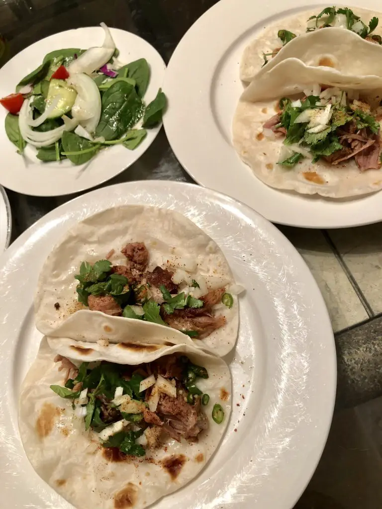 Pork Carnitas Tacos on a plate and salad