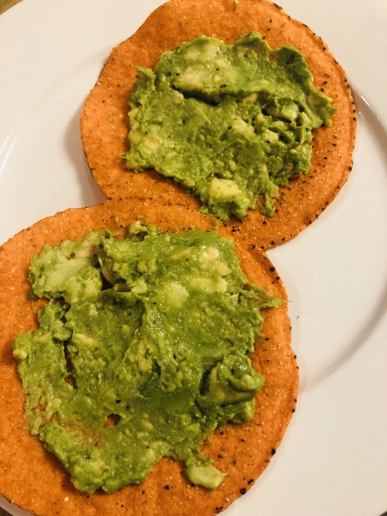 tostadas with mashed avocado on top