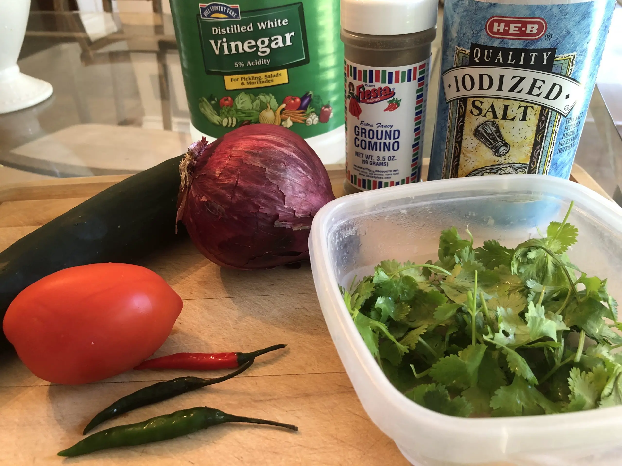 Cucumber, chilis, onion, tomato, cilantro, vinegar, cumin, and salt