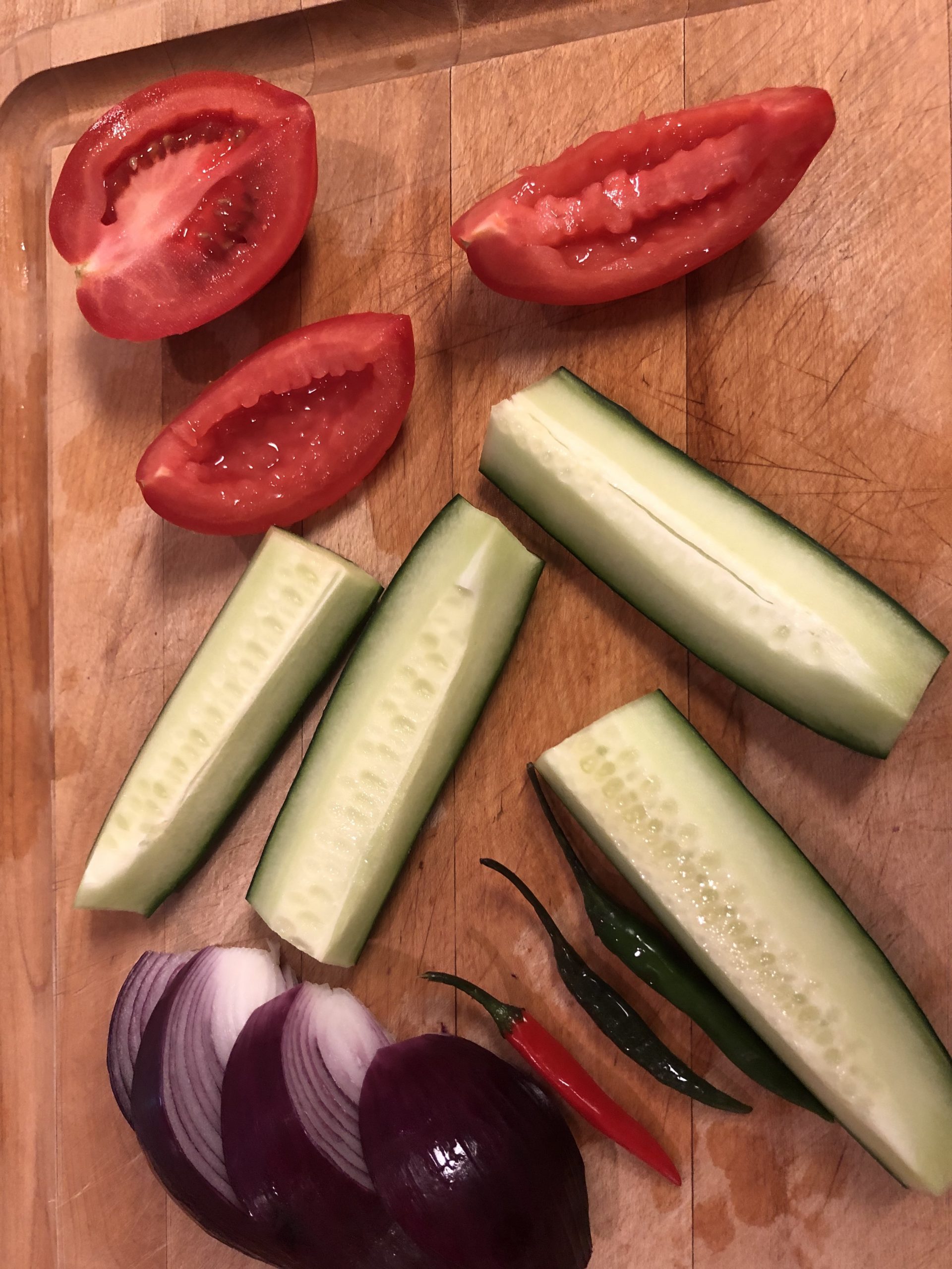 tomato, cucumber, chilis, and red onion