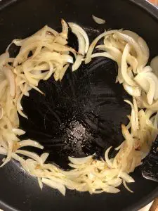 onions around the side of a skillet