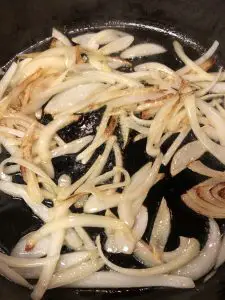 onions frying in a pan