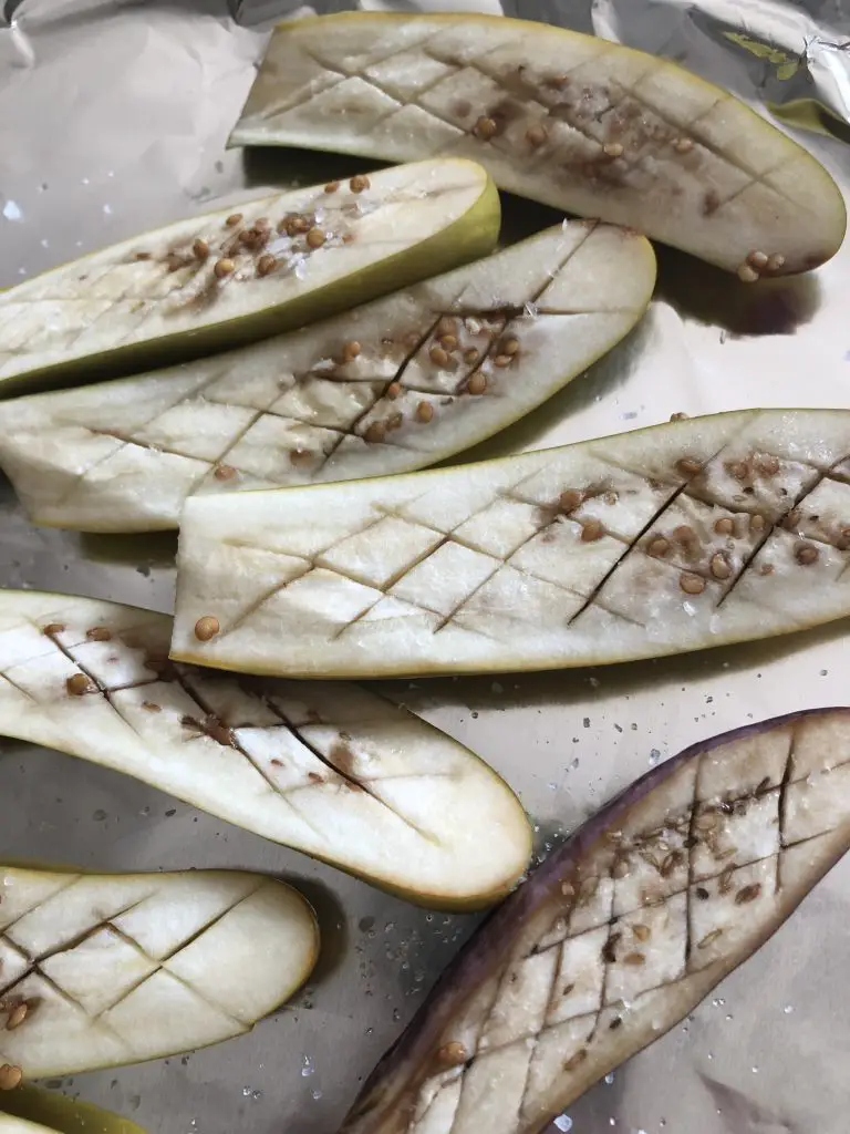 Japanese eggplant cut in half and scored