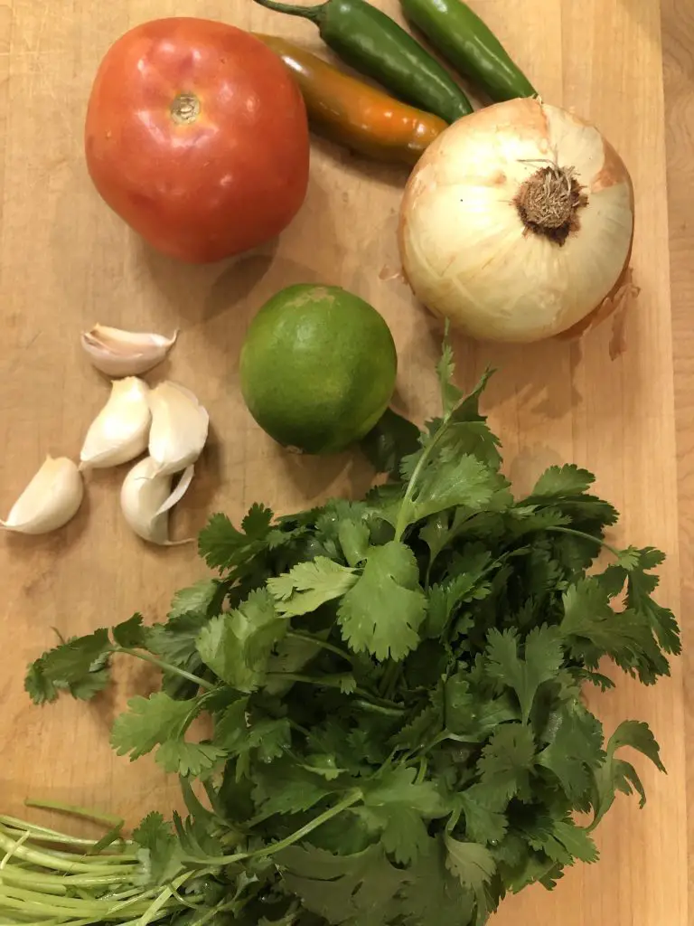 Onion, lime, cilantro, garlic, tomato, serrano peppers