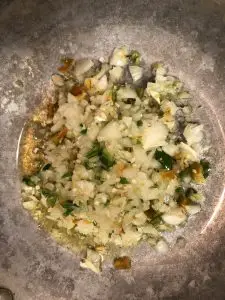 minced onion, garlic, and chilies in a skillet