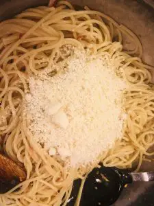 Spaghetti aglio olio e peperoncino and Parmesan cheese