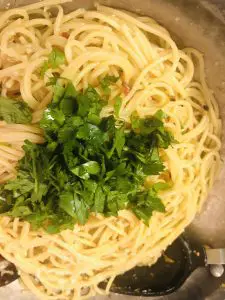 Spaghetti aglio olio e peperoncino and Italian parsley