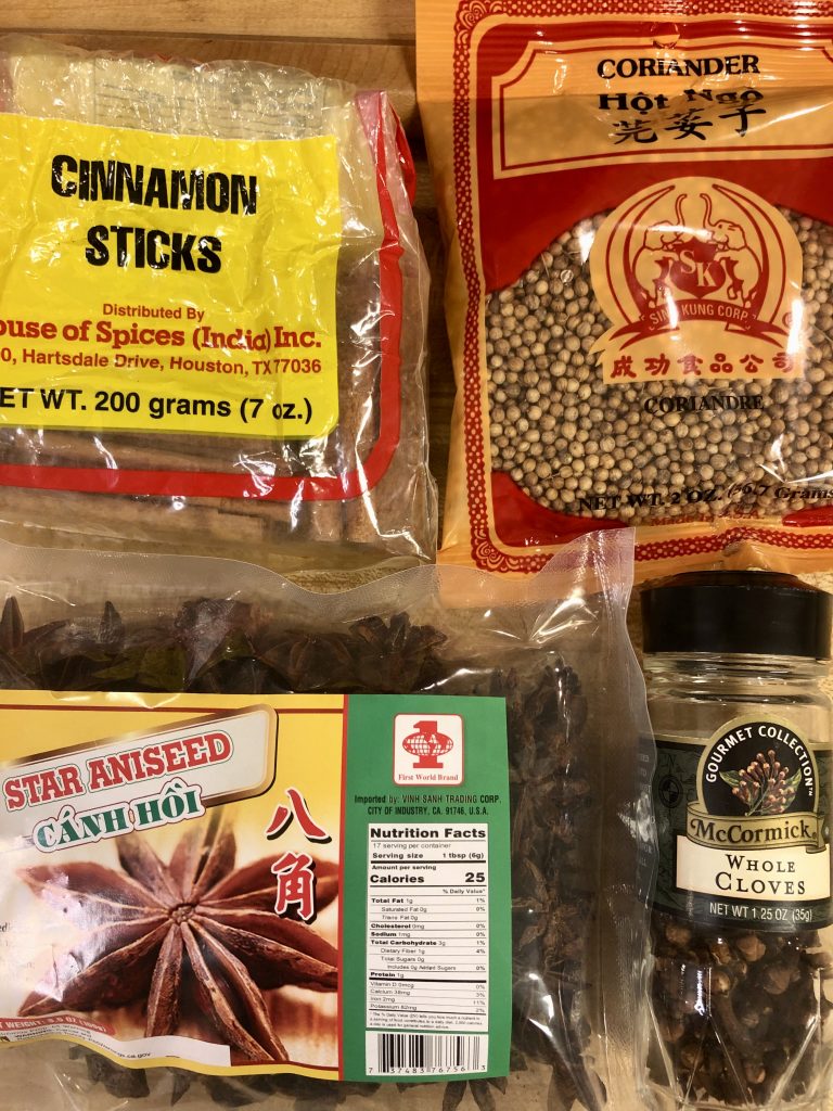 Coriander seeds, cinnamon sticks, star anise, and cloves
