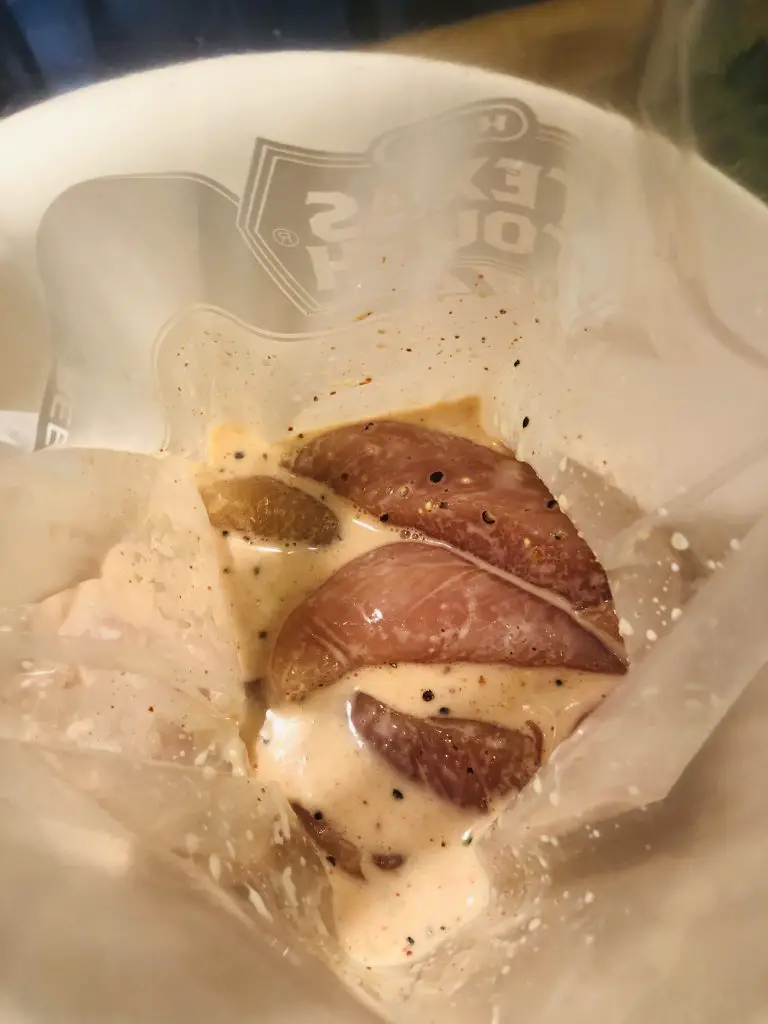 chicken tenders and marinade in a ziploc bag