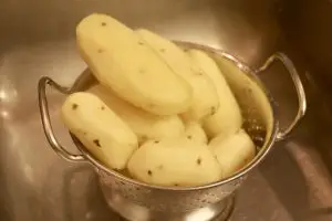 Peeled Potatoes in a colander