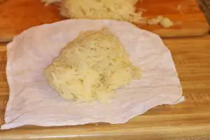 grated potatoes on a cheesecloth