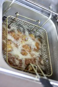 tater tots frying in hot oil