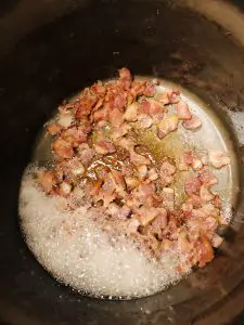 fried bacon in a stock pot