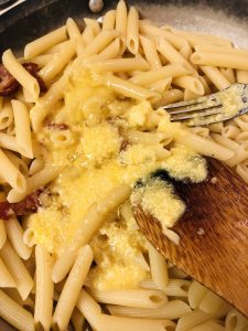 Penne Carbonara and a wooden spoon