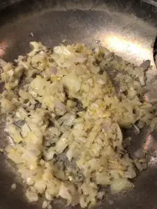 garlic, onion, and shallot all finely diced in a skillet