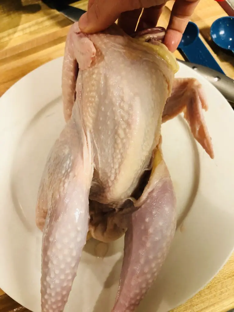 Stewing Hen with a white plate in the background