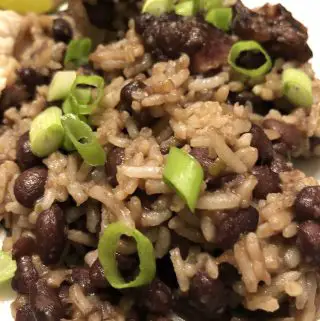 Cuban Black Beans and Rice garnished with green onions