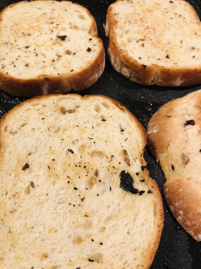 toasting slices of multigrain bread