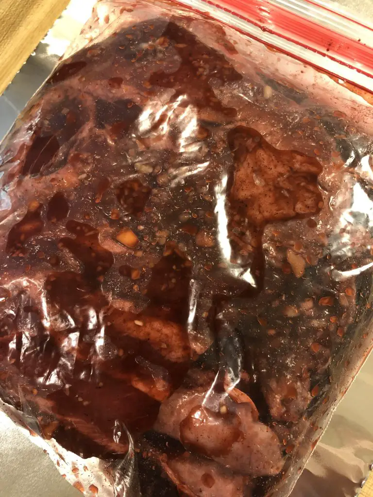Pork spareribs in a plastic sealed bag with marinade