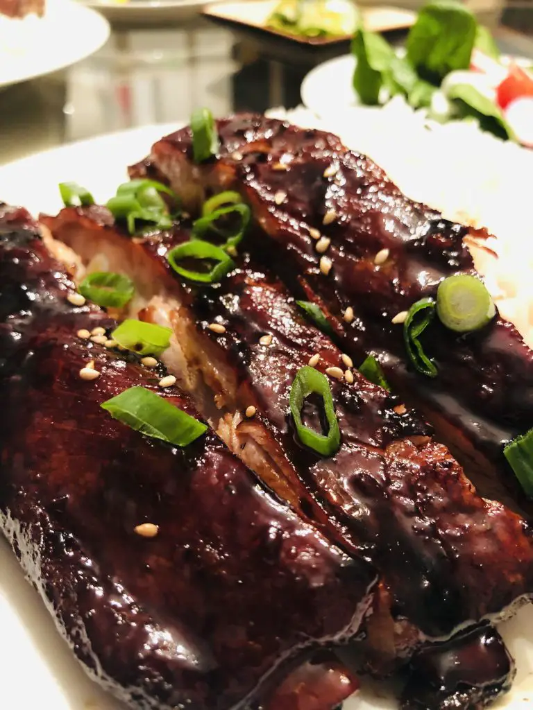 Chinese BBQ Spareribs garnished with green onions