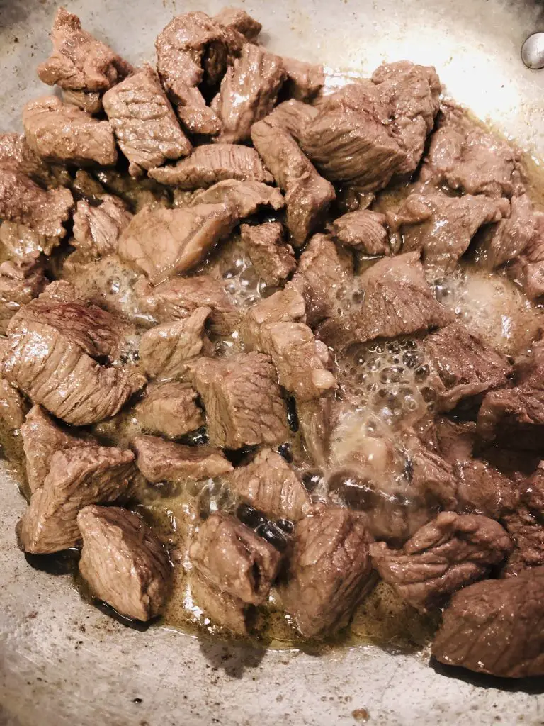 Beef which has been browned in a saute pan