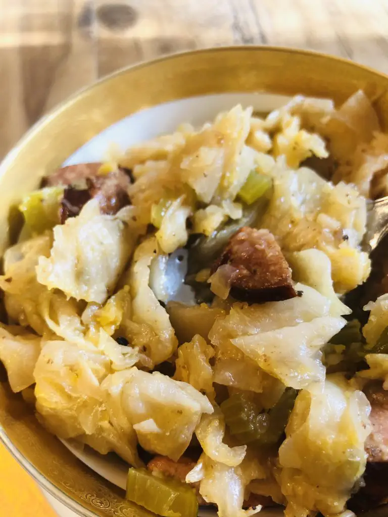Cajun Smothered Cabbage in a gold rimmed bowl