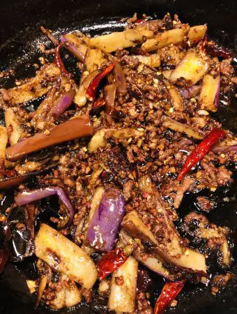 Sichuan Eggplant in a cast iron pan