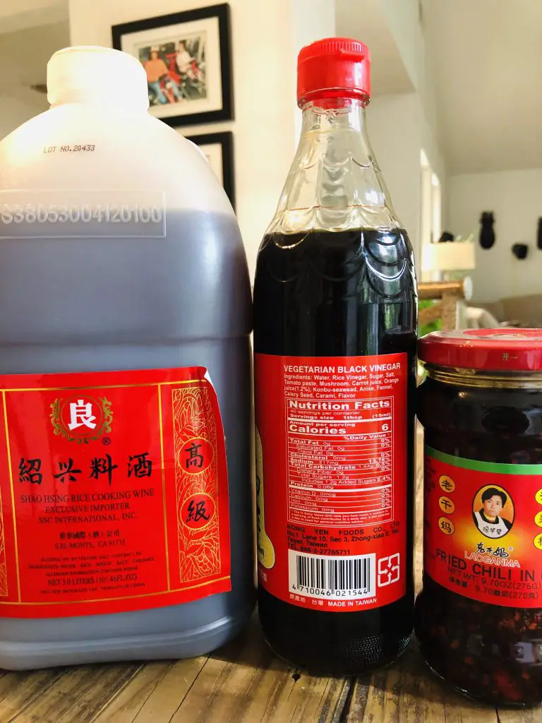 Bottles of Shaoxing Rice Wine, Black Vinegar, and Fried Chili in Oil