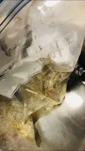pork chops in a ziploc bag in a water bath
