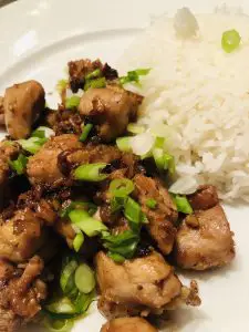 Vietnamese Lemongrass Chicken garnished with scallions and served with rice