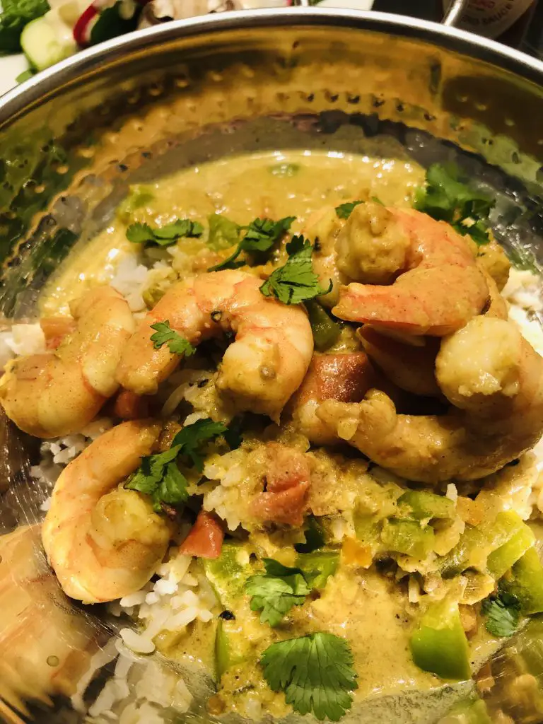 Coconut Curry Shrimp served with rice in a bowl
