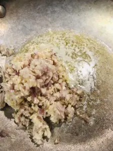 Minced shallot and garlic with butter in a skillet