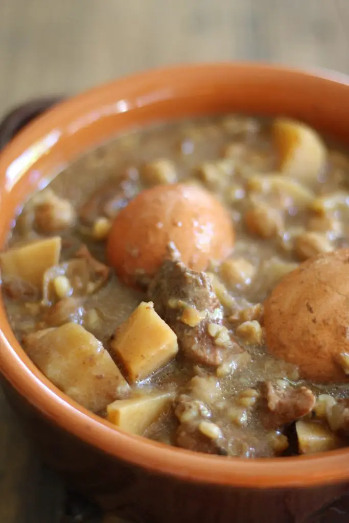 Cholent in a brown bowl