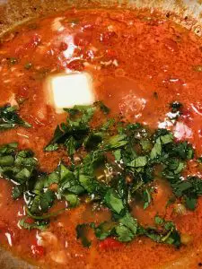 Red clam sauce with butter and Italian parsley