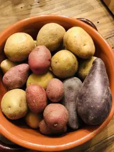 Colorful new potatoes in a brown bowl