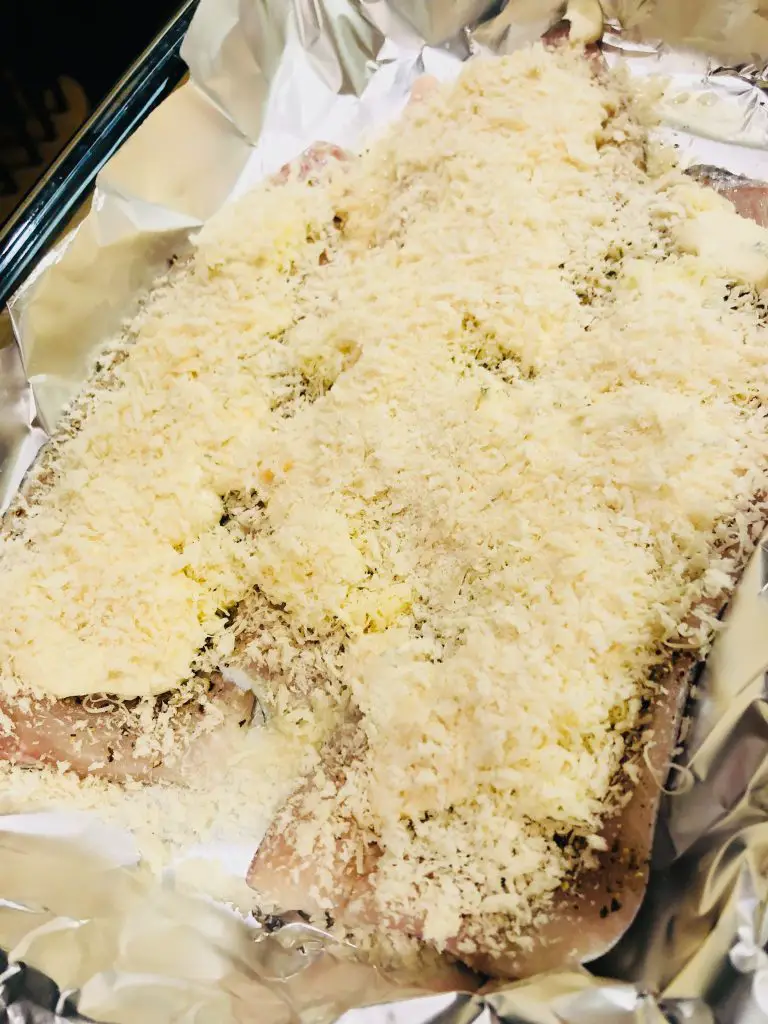 fish fillets covered with panko and placed in a baking dish lined with Aluminum foil