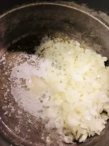 diced onion and butter in a pot