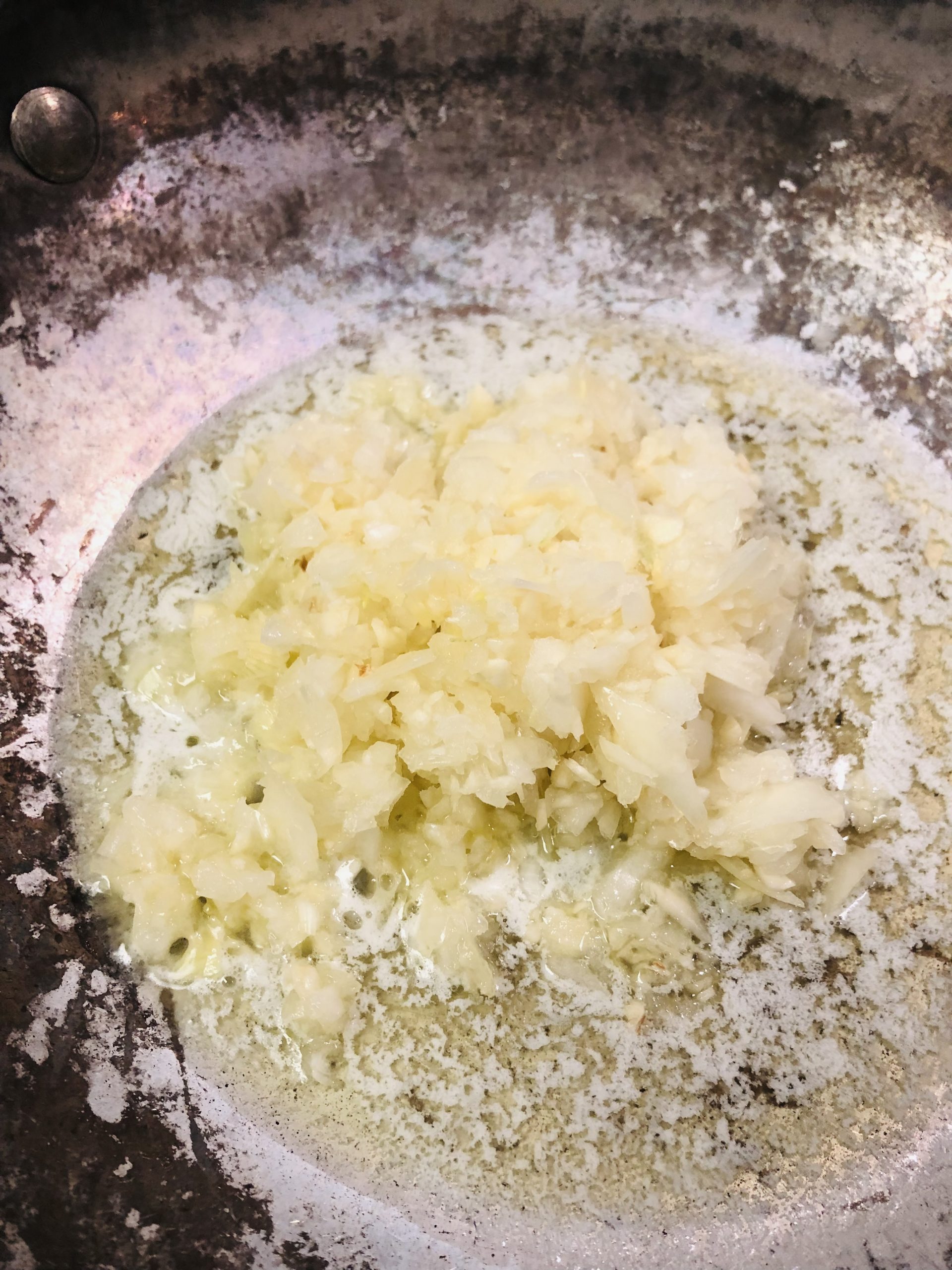 Minced garlic and onion and butter in a pan