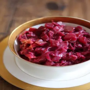 Danish red cabbage in a white bowl with a gold rim