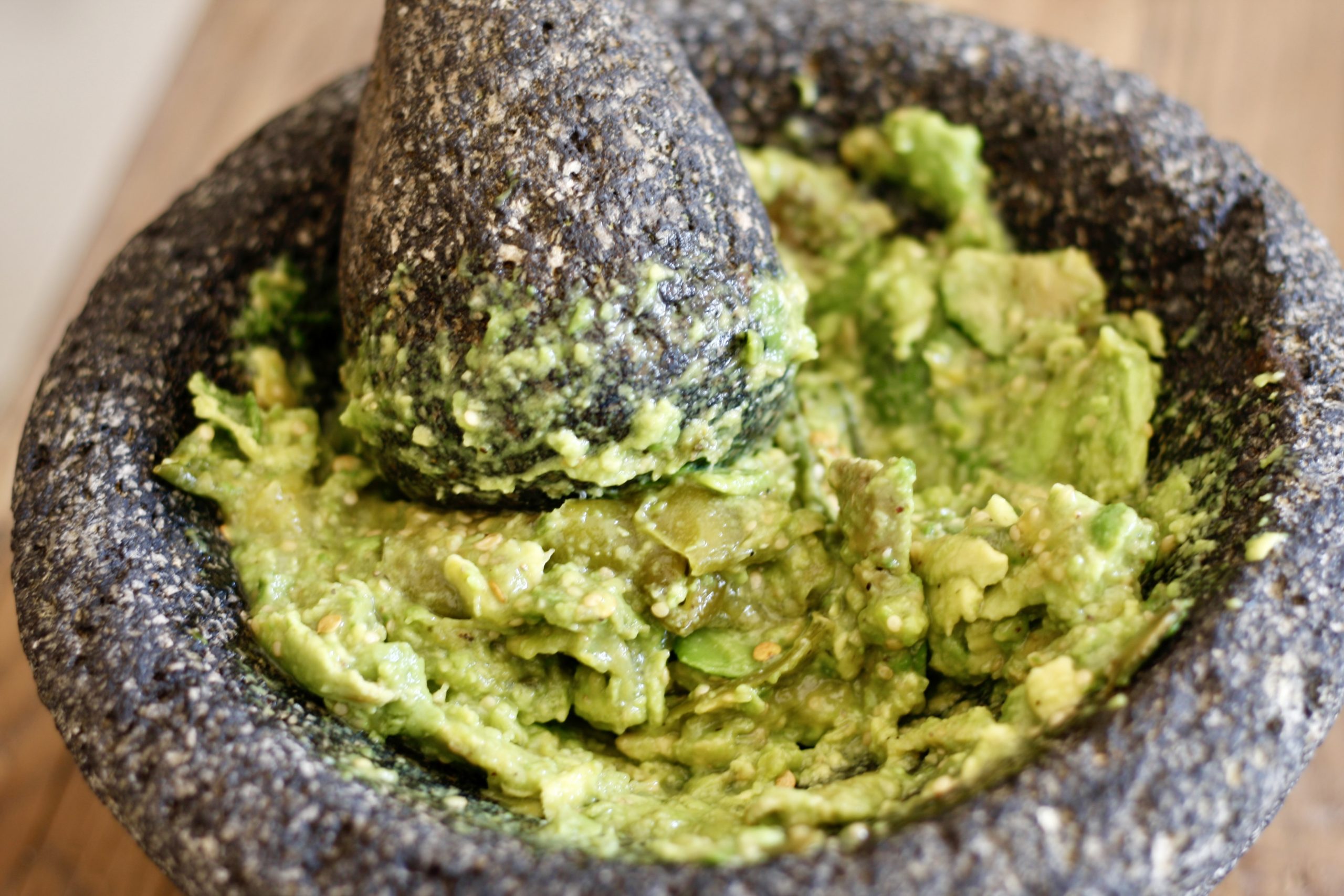 Guacamole in a molcajete with a pestle