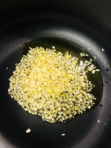 minced ginger and garlic in olive oil in a pan