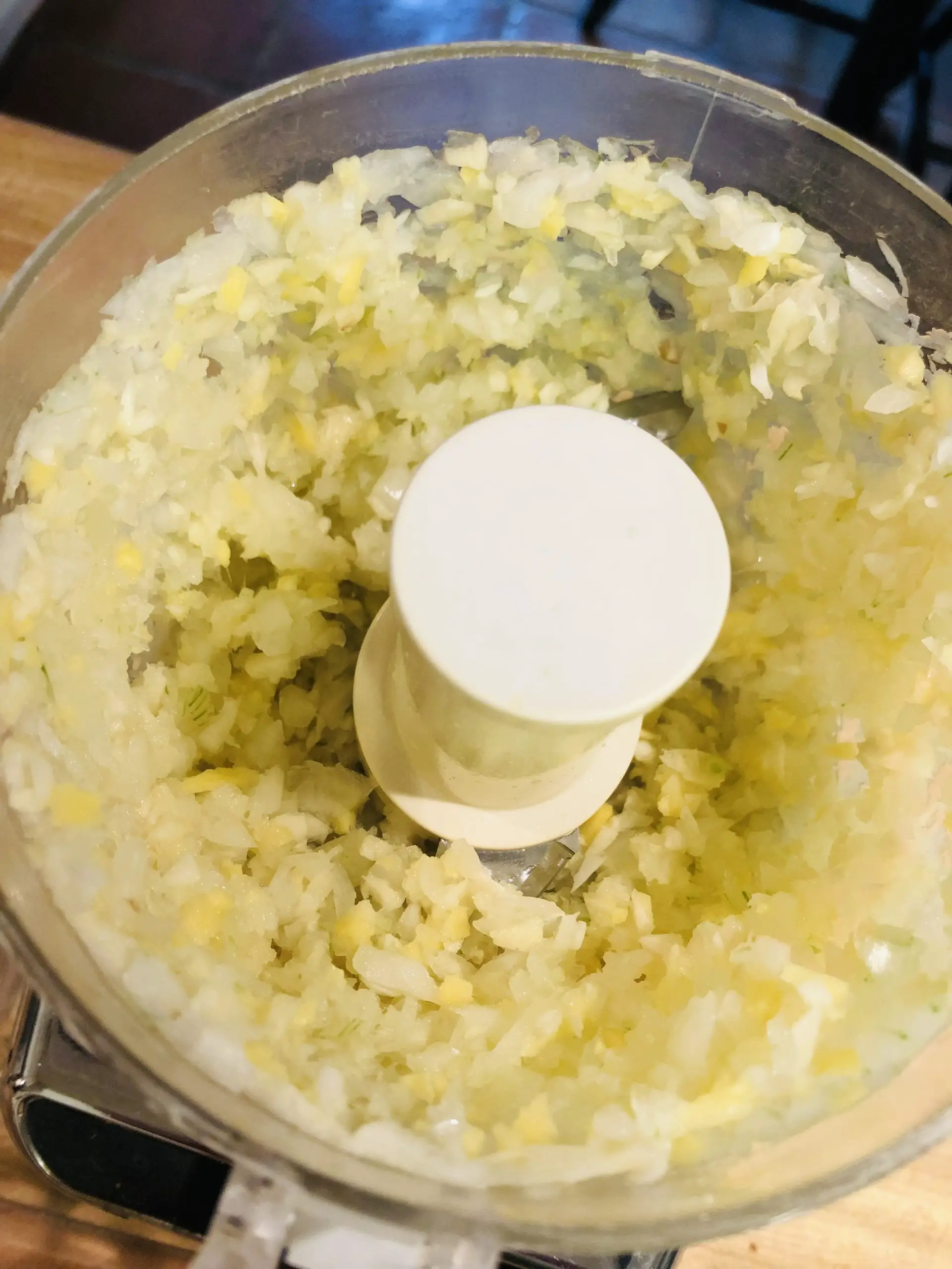Minced onion, garlic, and ginger in a food processor